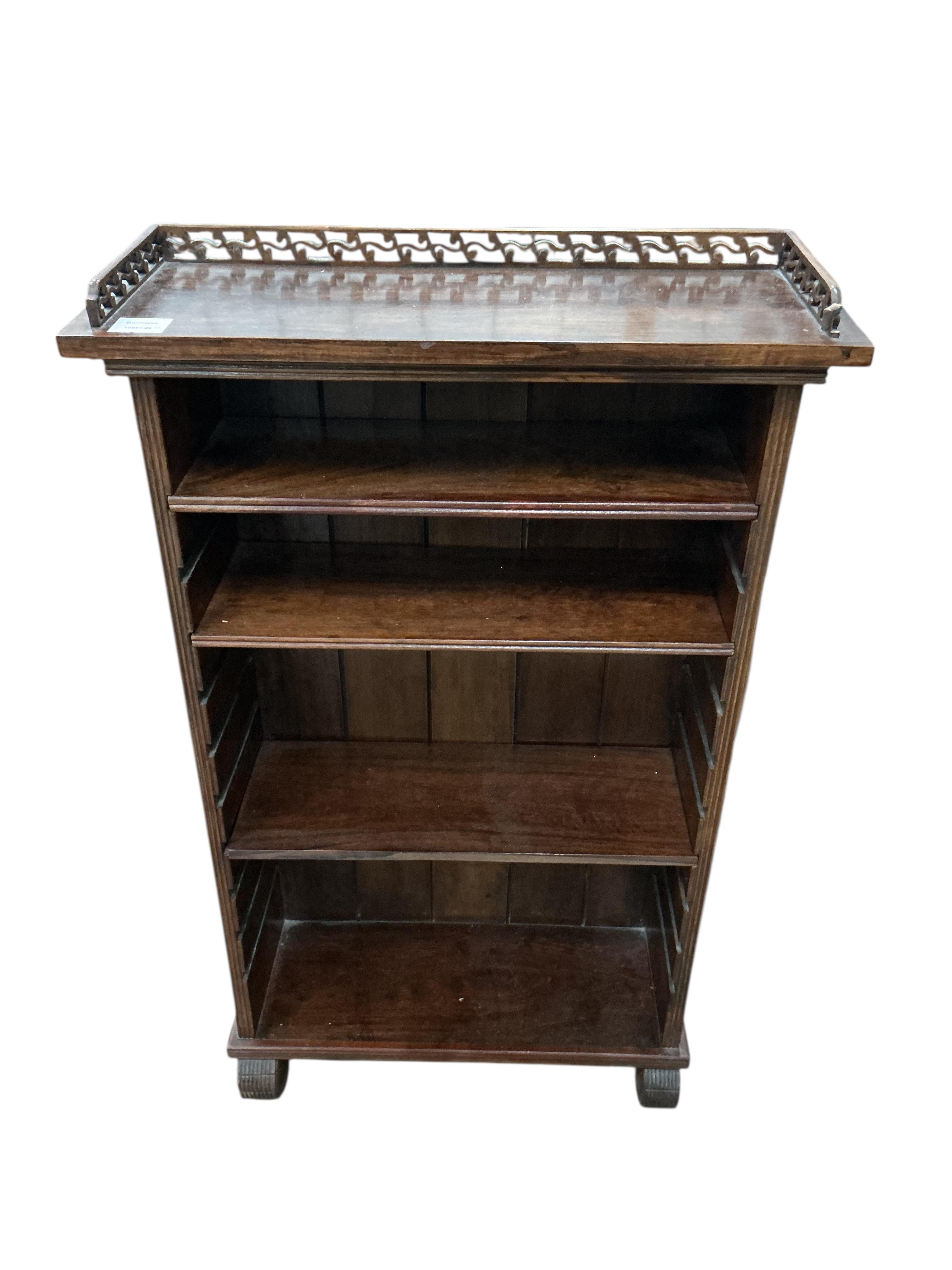 A small reproduction hardwood open bookcase, width 59cm, depth 22cm, height 100cm